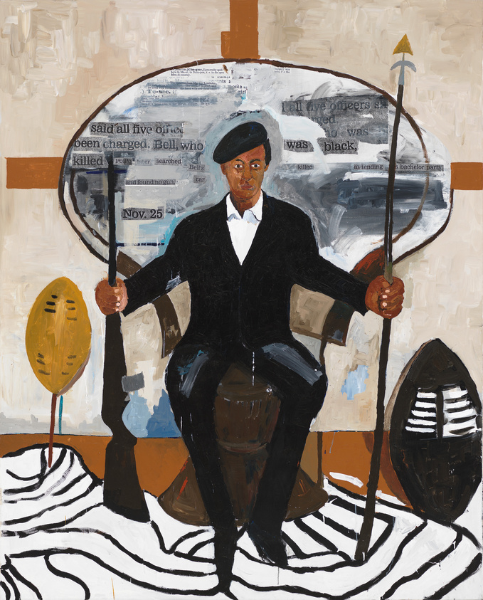 A Black man wearing a black beret, suit jacket, and slacks sits in a peacock chair. The back of his chair is various shades of grey and features glimpses of newspaper clippings throughout. He holds a spear in his left hand and a rifle in the other. The floor is rust colored with an irregularly shaped zebra print rug. The wall behind him is off-white with rust colored intersecting lines.