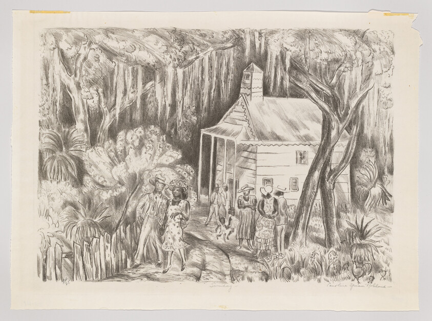 A group of people gather and talk outside a small wooden house in a shaded forest.