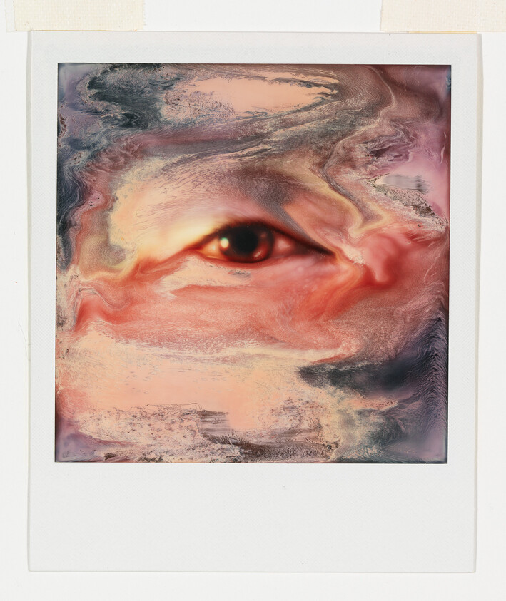 A single human eye emerges from swirling pink, peach, and gray marbled textures.