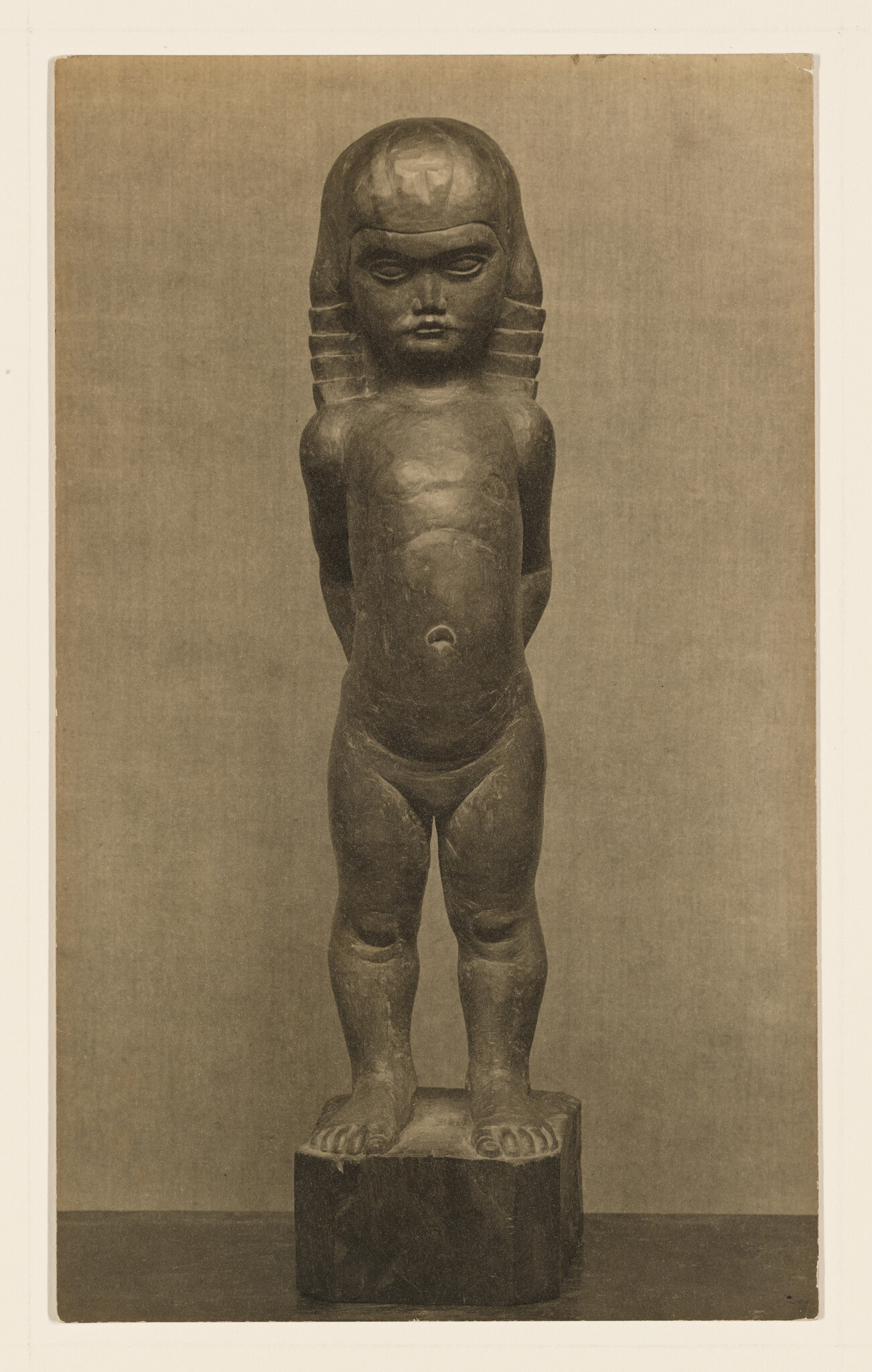 A carved wooden standing child statue with stylized hair and hands clasped behind its back.