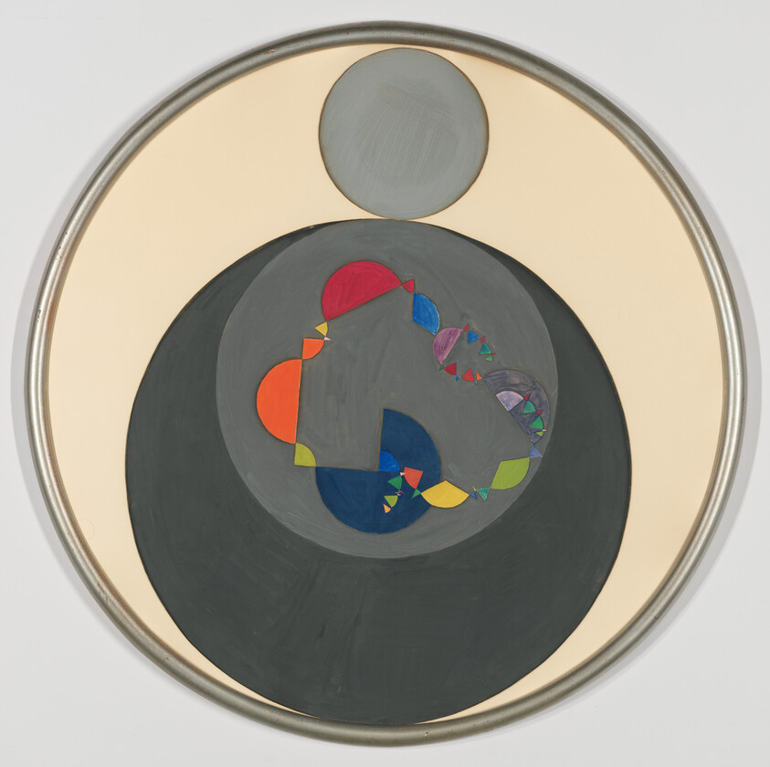 Circular abstract painting with concentric dark circles and colorful geometric shapes in center.