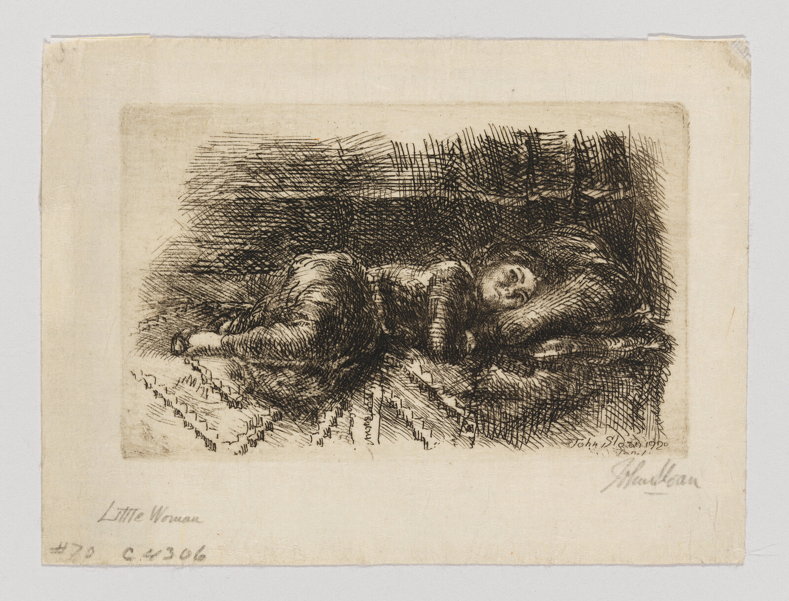 A young woman curled on her side sleeping on a textured blanket and pillow.