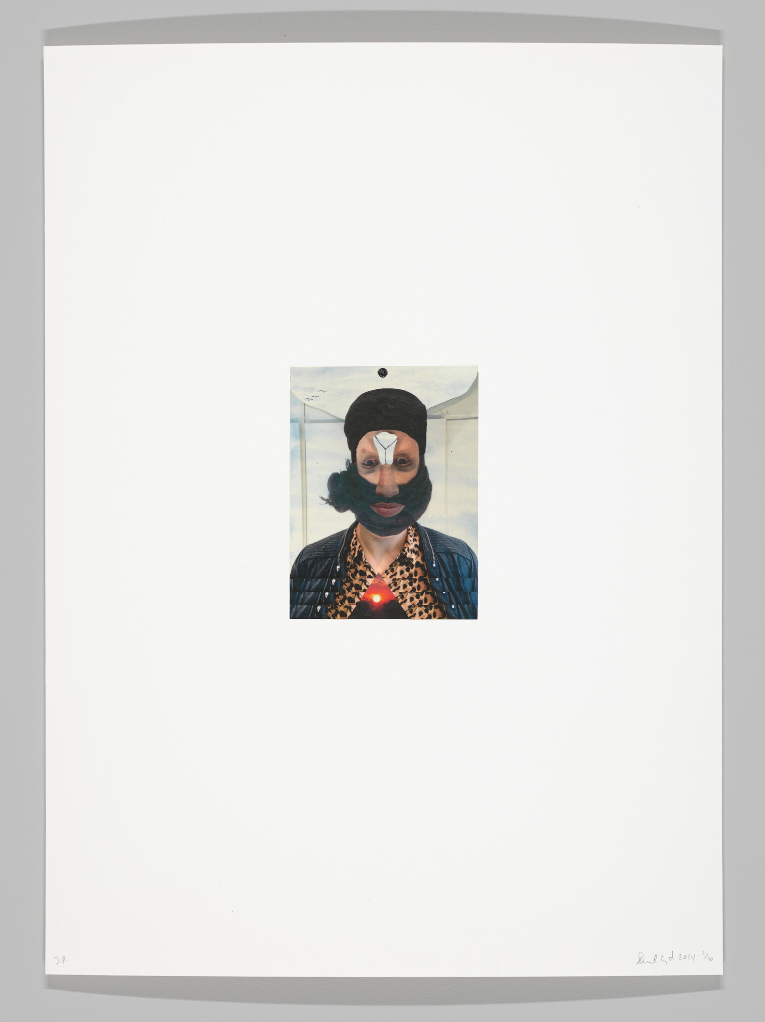 A small centered collage shows a person in a black mask with a glowing red triangle on their chest.