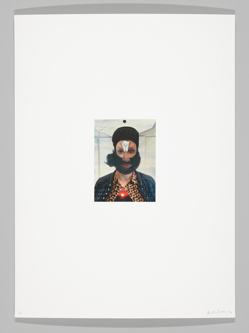 A small centered collage shows a person in a black mask with a glowing red triangle on their chest.