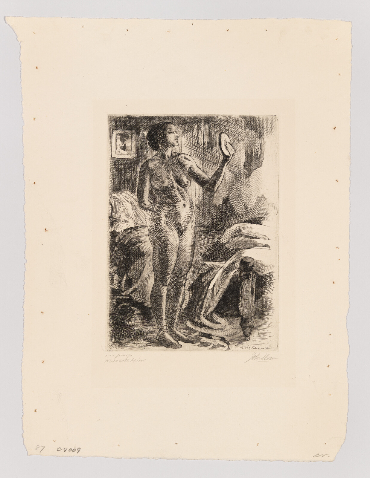 A nude woman stands beside a bed, looking at herself in a small hand mirror.