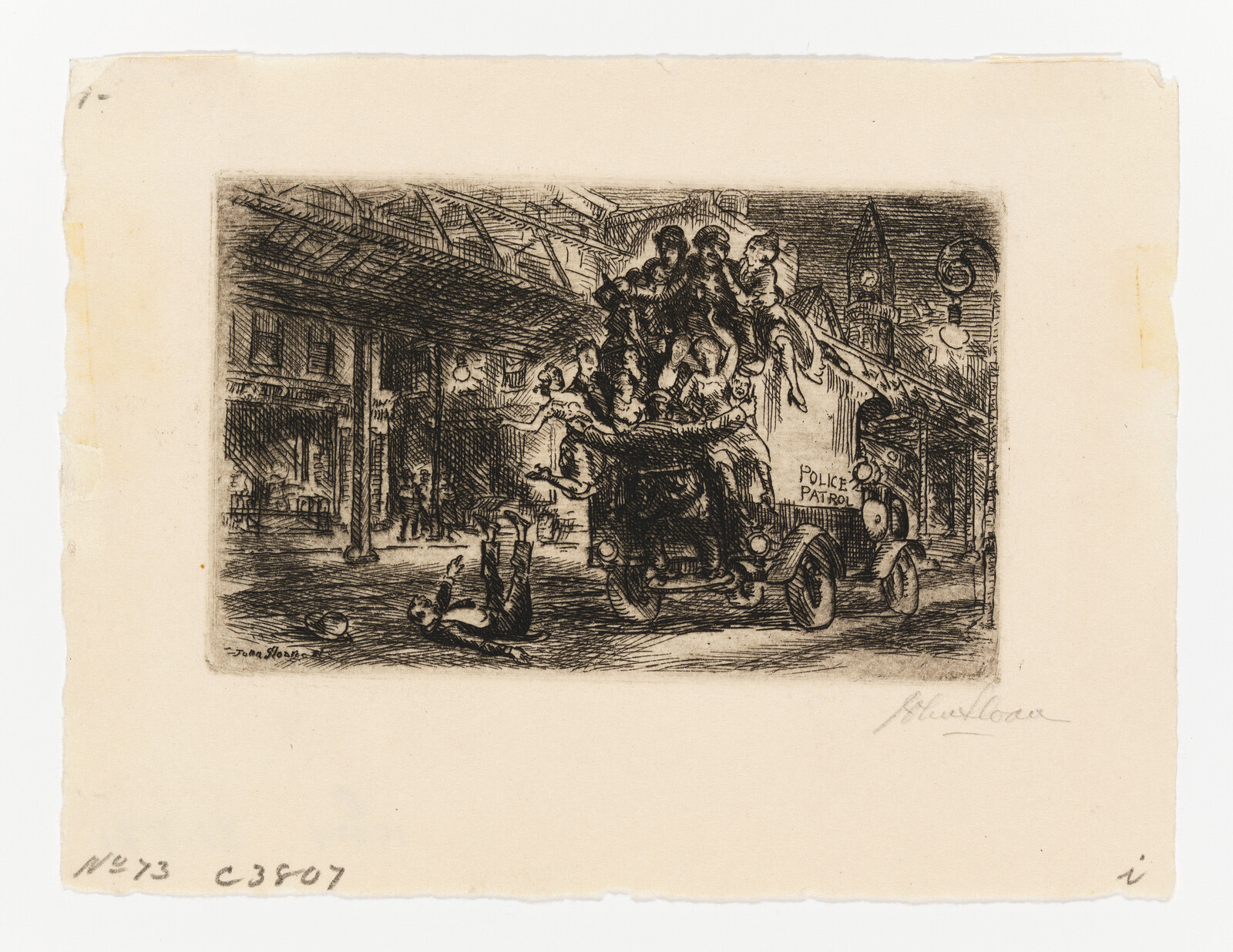 An overloaded police patrol wagon carrying many people passes under a bridge as a man falls in front.