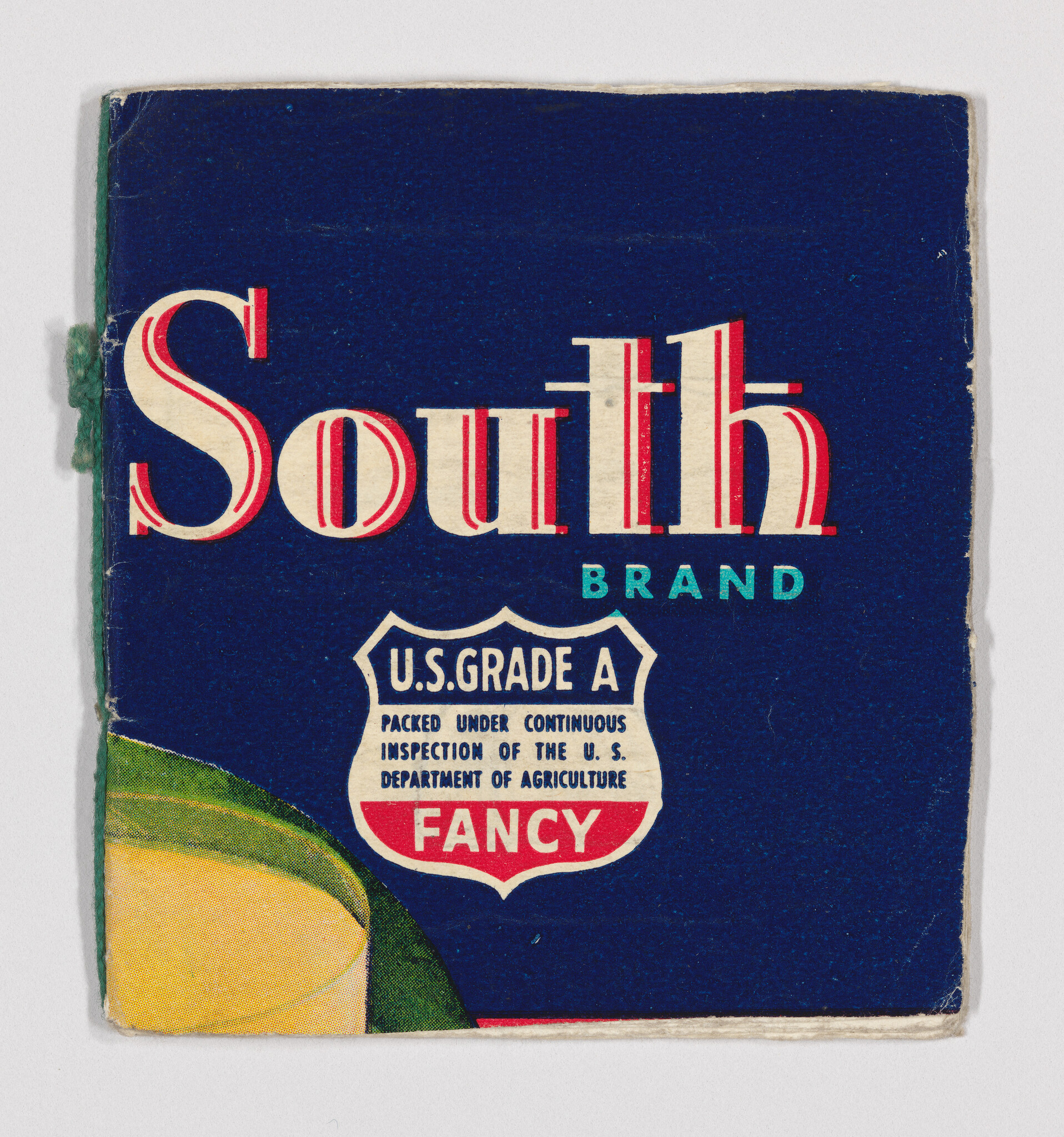 Blue South Brand label with U.S. Grade A Fancy shield and partial fruit illustration.