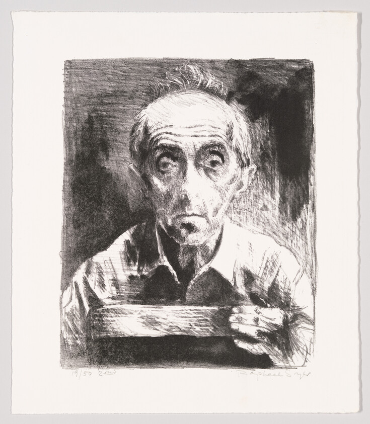 Elderly man with gaunt face holds a rectangular board while staring directly ahead.