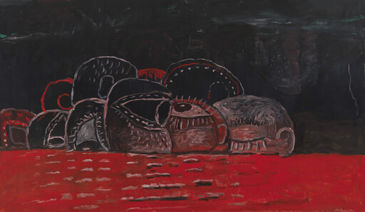 Dark rounded forms resembling masks or shells rest against a red surface under a black sky.