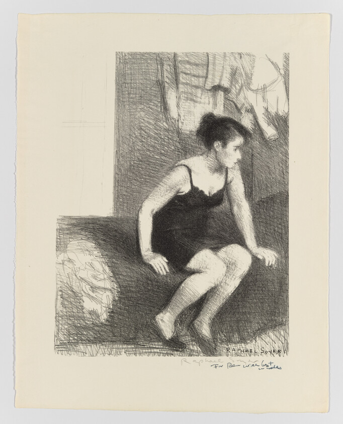 A woman in a black slip sits on the edge of a bed looking to the right.