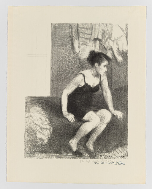 A woman in a black slip sits on the edge of a bed looking to the right.