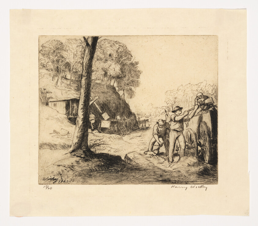 Three men push and steady a large wooden cart on a dirt path near a thatched shelter.