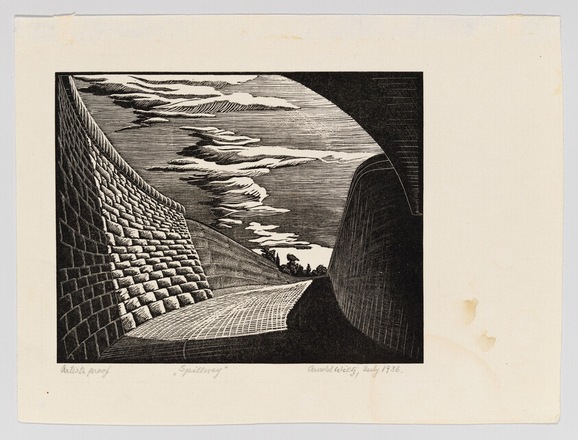 Curved brick-lined spillway with textured walls leading toward distant trees under dramatic clouds.
