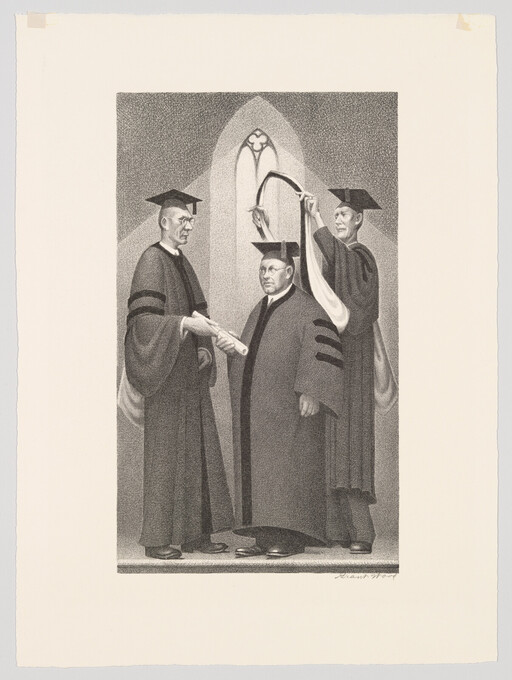 Three men in academic robes perform a hooding ceremony as one receives a diploma.