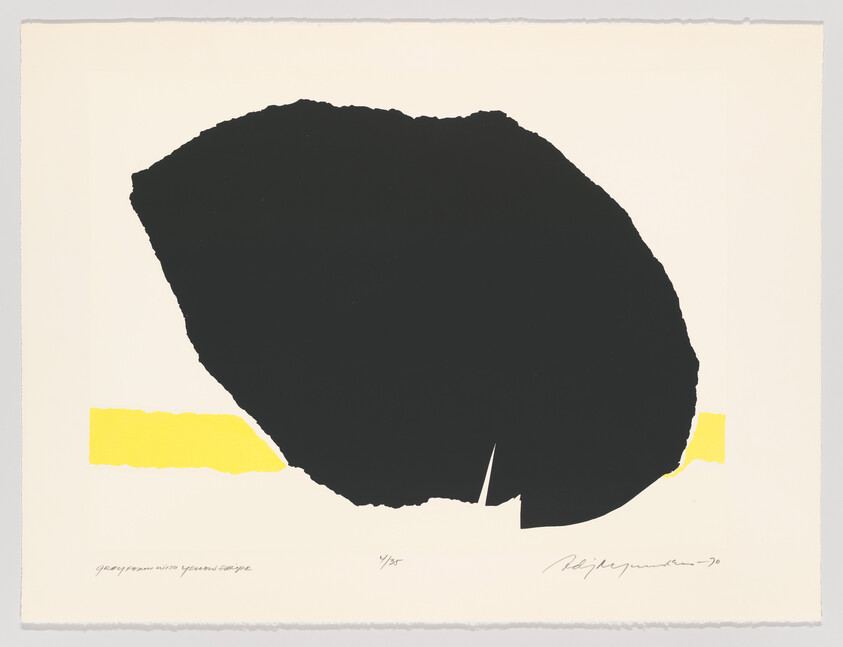 A large irregular black shape sits above a horizontal yellow band on a light background.