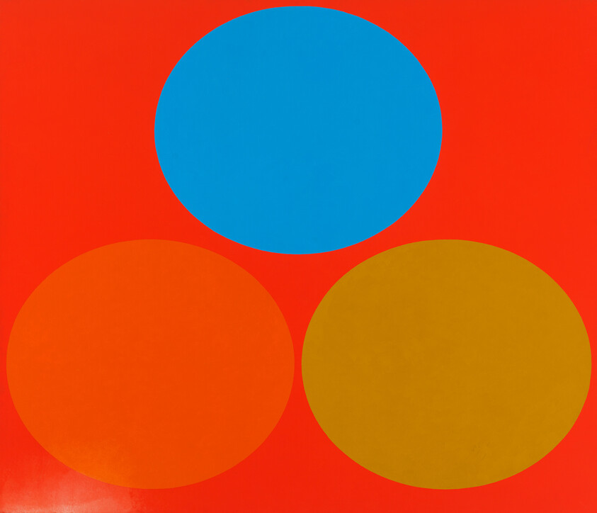 Three large colored circles—blue above orange and mustard—sit against a bright red background.