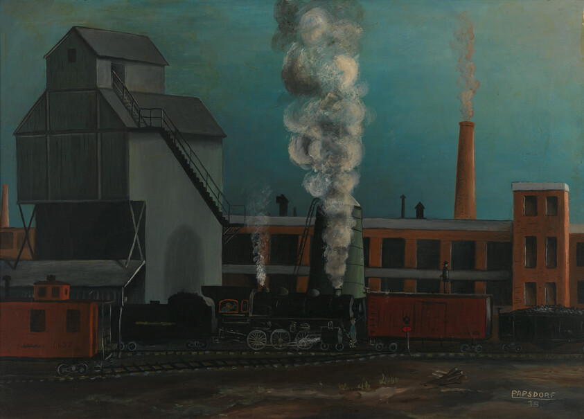 A steam locomotive emits thick white smoke while parked on tracks beside factory buildings.