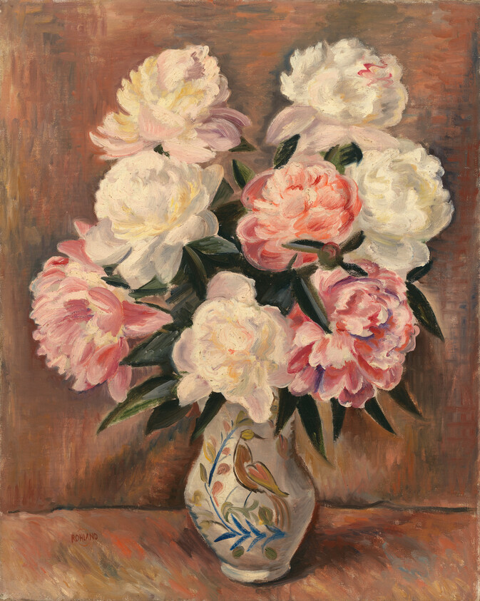 A ceramic vase holds a full bouquet of white and pink peonies on a table.