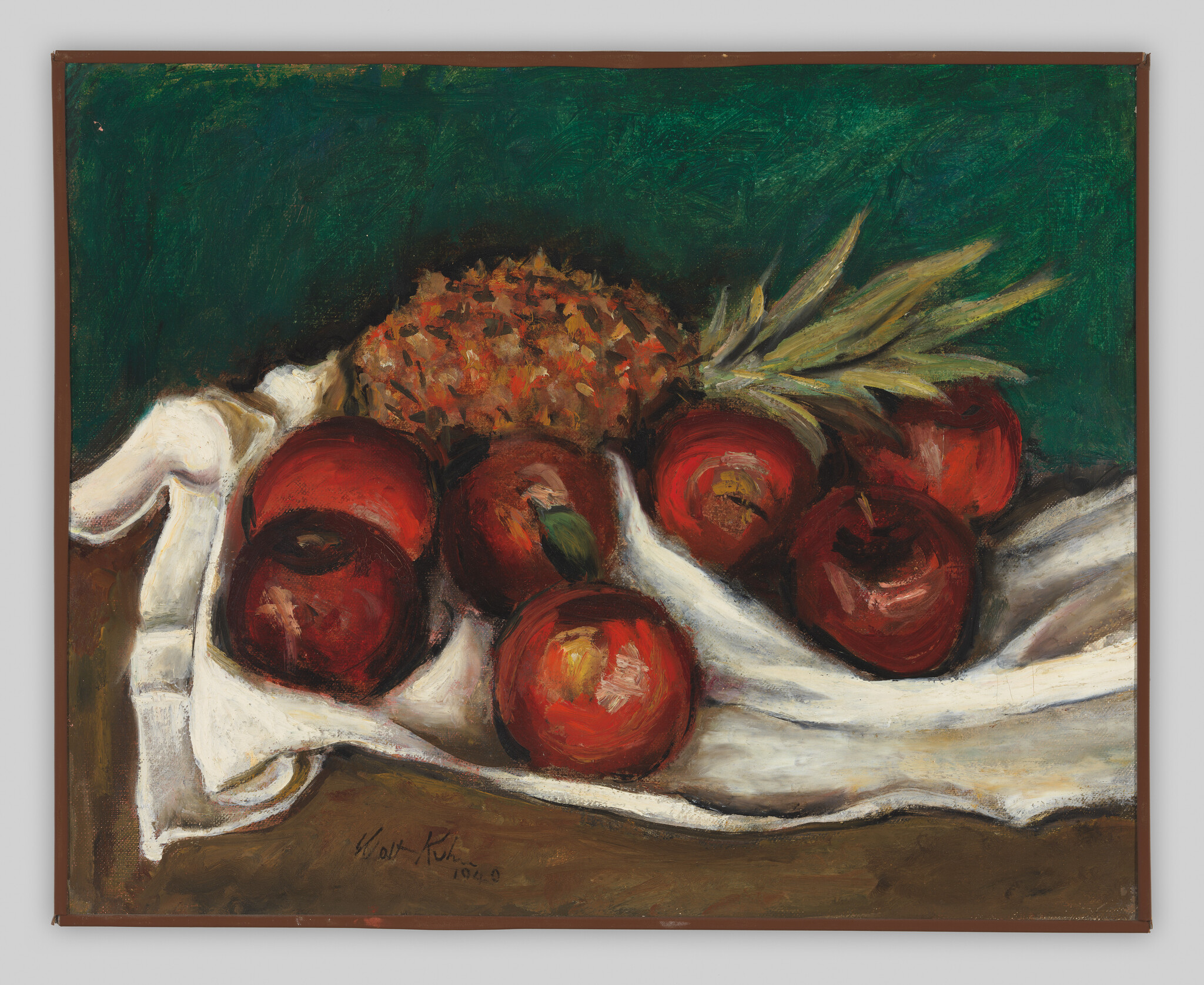 A still-life arrangement of red apples and a pineapple resting on a white cloth against dark green.