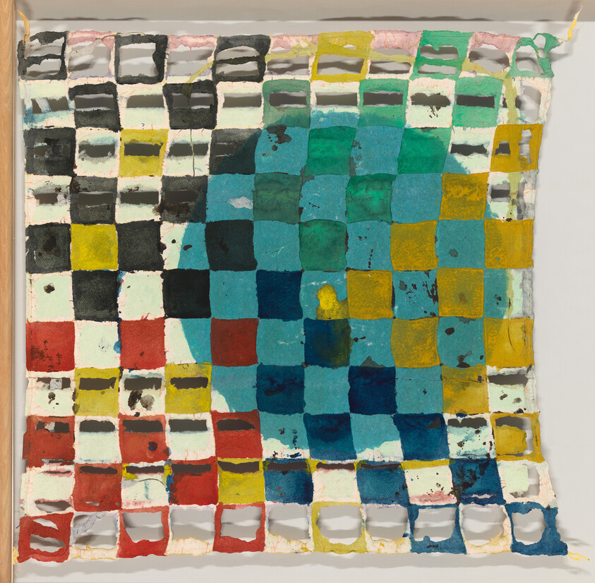 Woven grid of painted paper squares in red, yellow, teal, and black with torn edges.