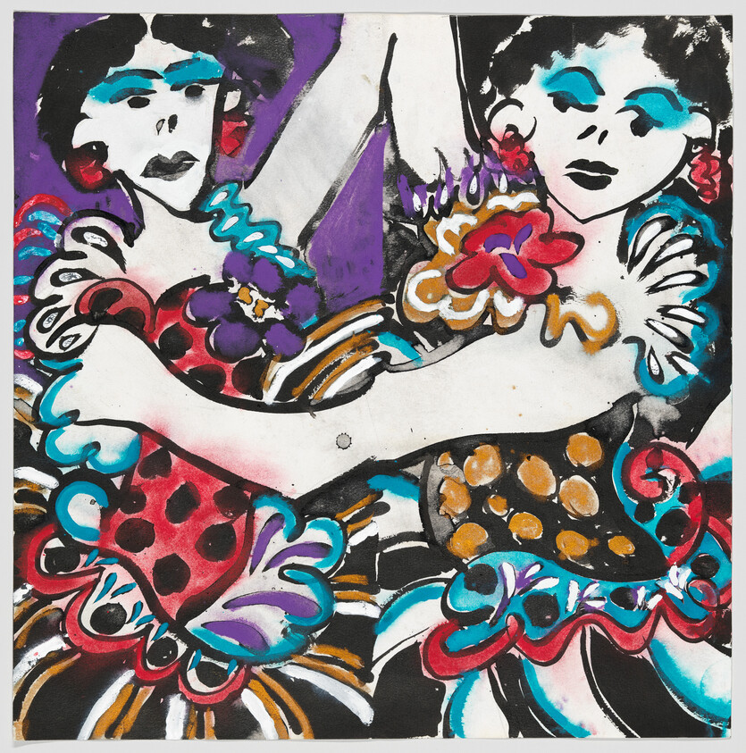 Two female dancers embrace while wearing colorful ruffled dresses and bold makeup.