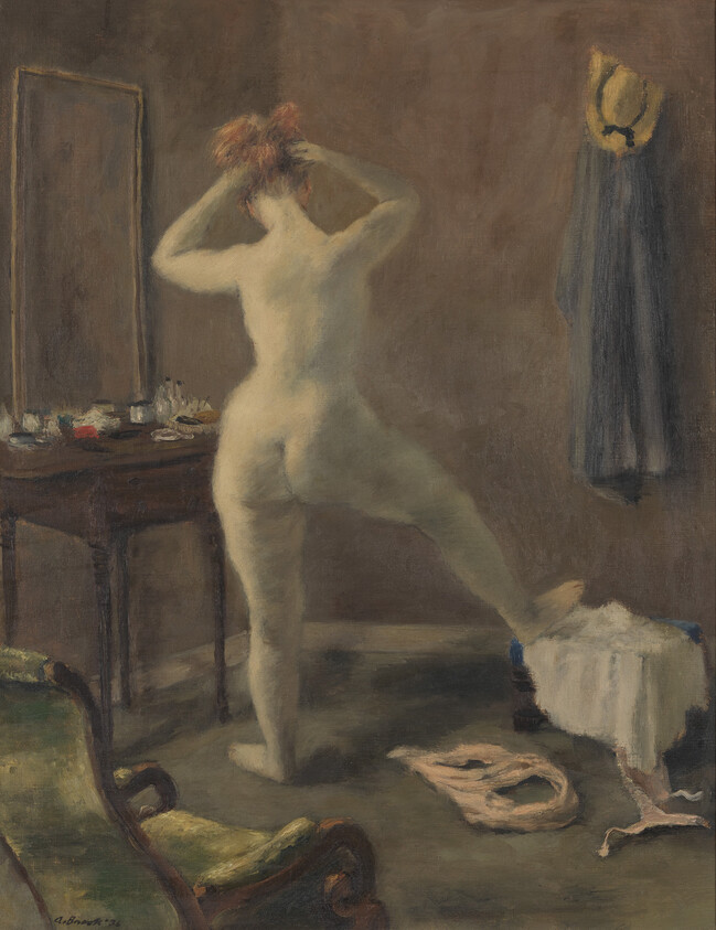 A nude woman stands with one leg on a stool, tying her hair in a dressing room.