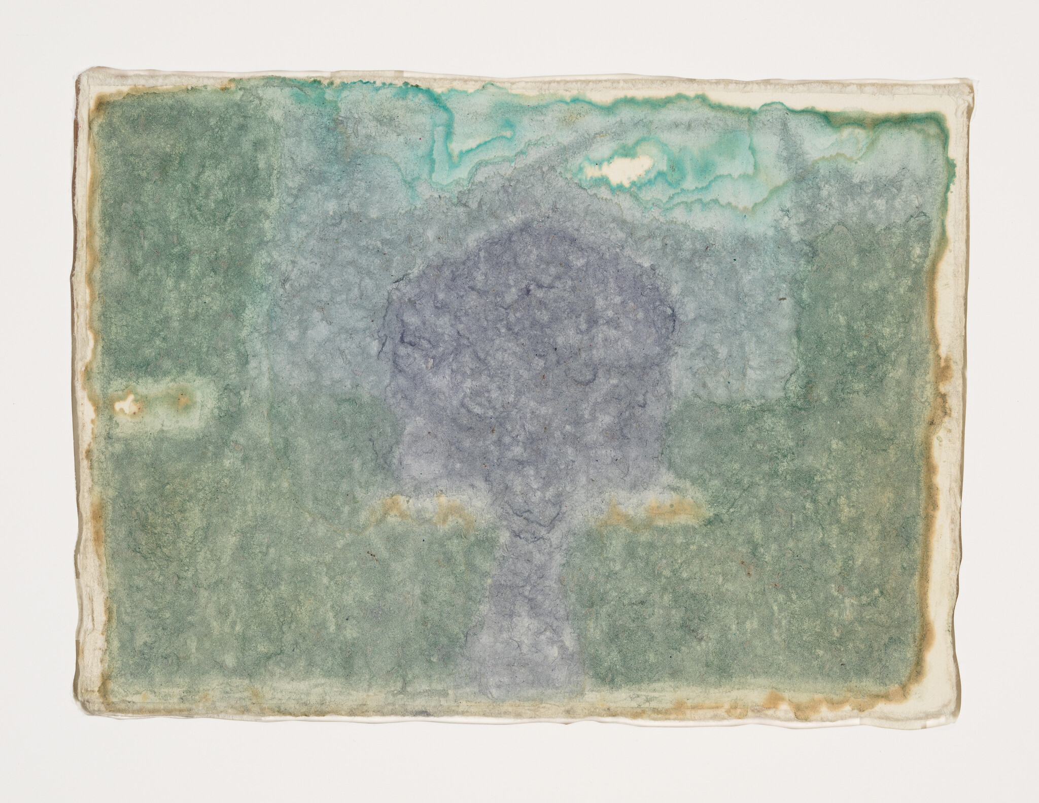 Faded green and blue watercolor wash on paper with a darker rounded shape at center.