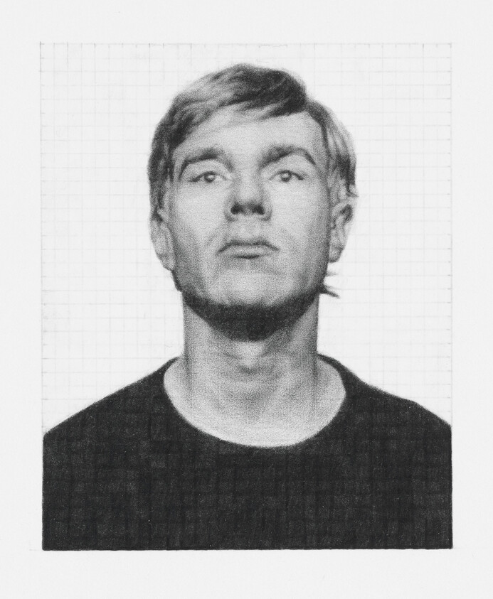 A man with short hair and a serious expression faces forward, wearing a dark shirt against a grid background.