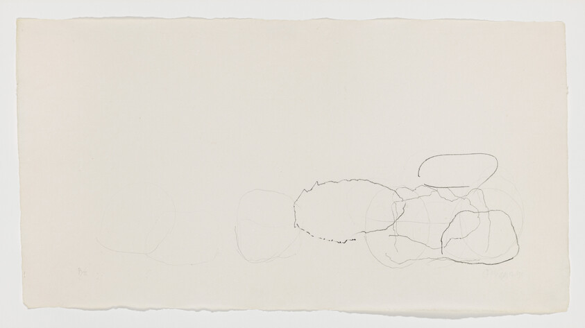 Several faint overlapping pencil ovals and scribbles clustered near the right side of a cream sheet.