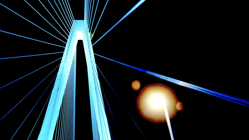 Tall cable-stayed bridge tower with cables stretching outward, seen at night with a bright streetlight nearby.