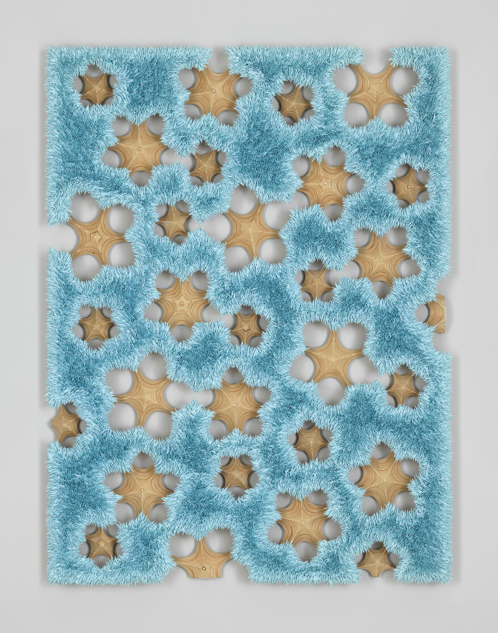 Blue shaggy textile panel with repeating star-shaped wooden cutouts arranged in a grid pattern.