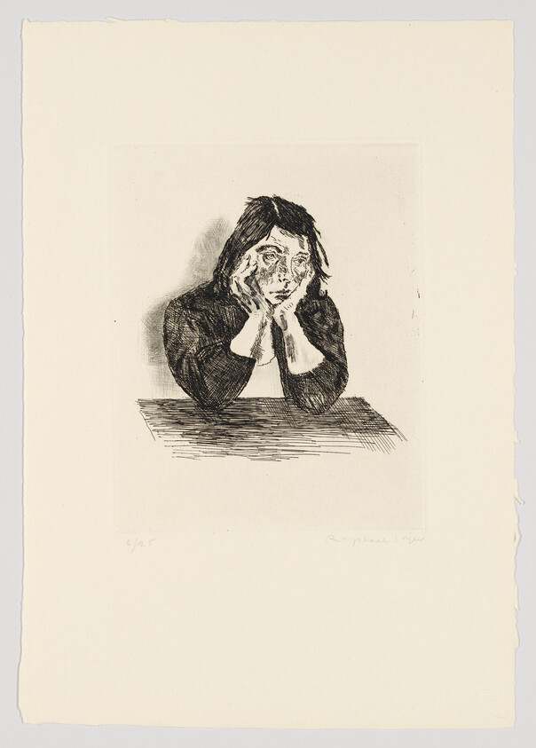 A person rests their face in their hands while leaning on a table, looking tired.