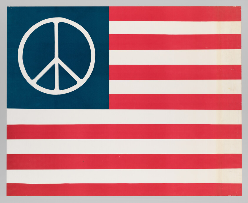 A red and white striped American-style flag with a blue field containing a large white peace symbol.
