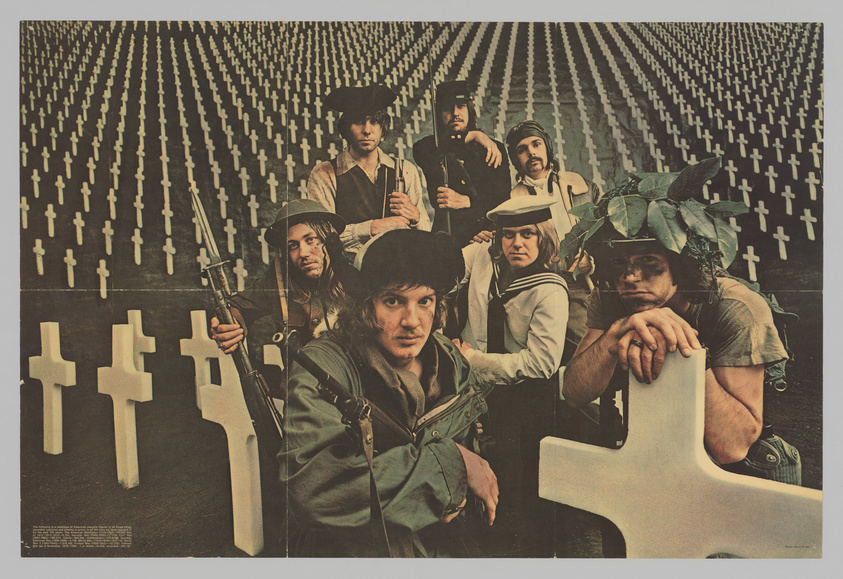 A vintage poster featuring seven individuals dressed in a mix of military and historical costumes, posing with weapons in front of a backdrop of countless white crosses. The setting suggests a commentary on war, with a somber and reflective mood.