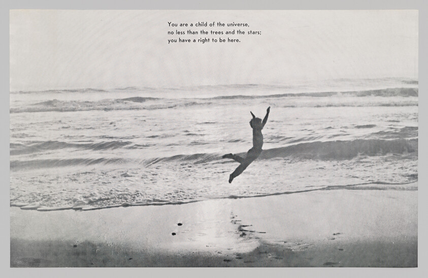 A person leaps joyfully above the wet sand near incoming ocean waves at the beach.