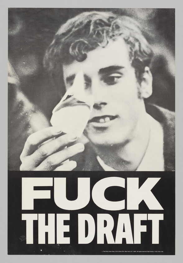 Young man holding an object with large text reading "FUCK THE DRAFT" protesting conscription.