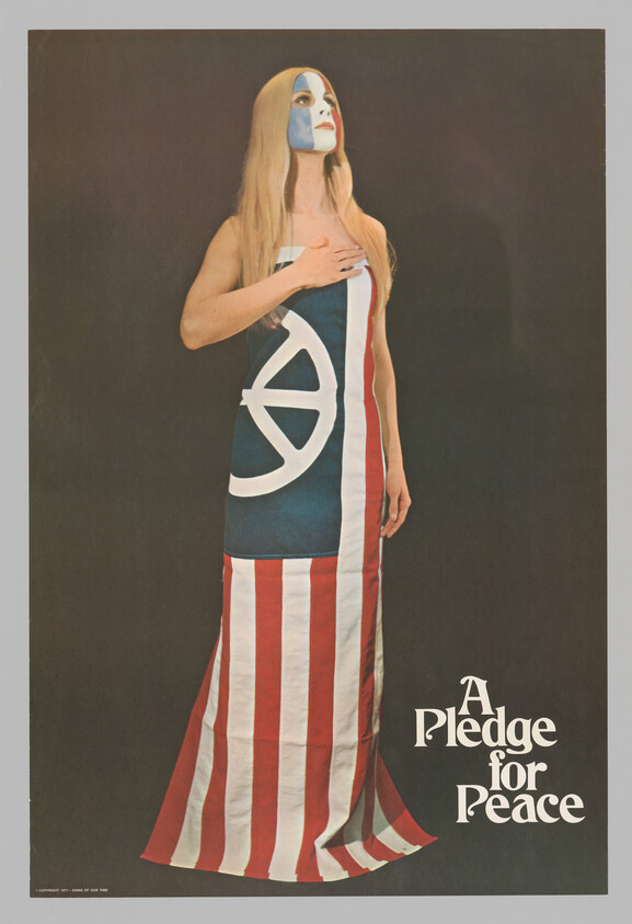 A woman wearing a flag dress and face paint stands with her hand over her heart.