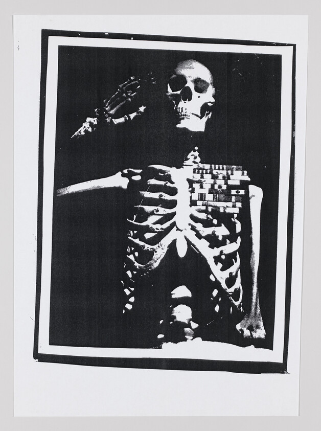 A black-and-white framed skeleton facing forward with one arm raised and ribcage visible.