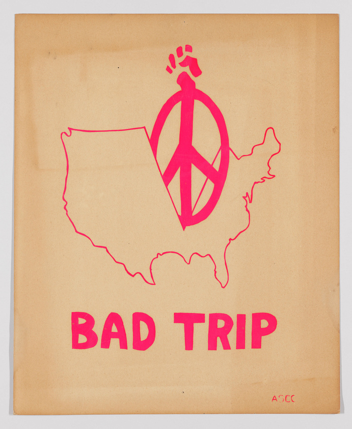 A graphic artwork featuring a pink outline of the contiguous United States with a peace symbol superimposed over the center. Above the peace symbol, a small explosion or burst is depicted. Below the map, the words "BAD TRIP" are written in bold, pink letters. The background is a brownish paper, and there is a signature or initials "A-SCC" in the bottom right corner.