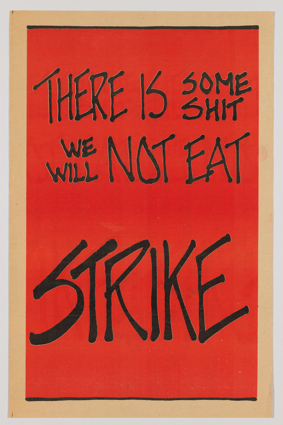 A protest poster with a bright red background and bold black handwritten text that reads "THERE IS SOME SHIT WE WILL NOT EAT" above the word "STRIKE" in large letters. The poster has a rough, handmade quality and is mounted on a beige paper backing.