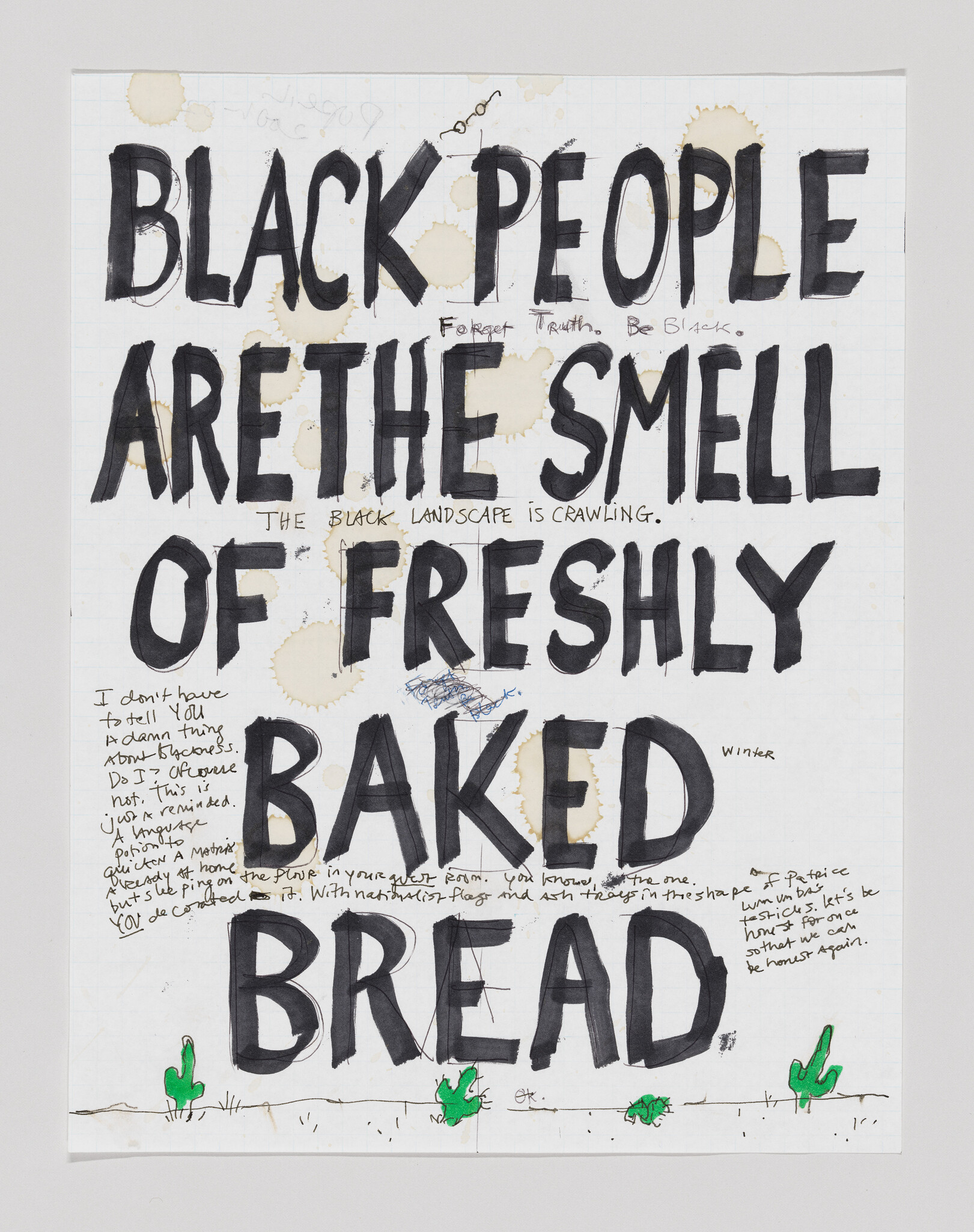 Large handwritten sign reading "Black people are the smell of freshly baked bread" with coffee stains and doodles.