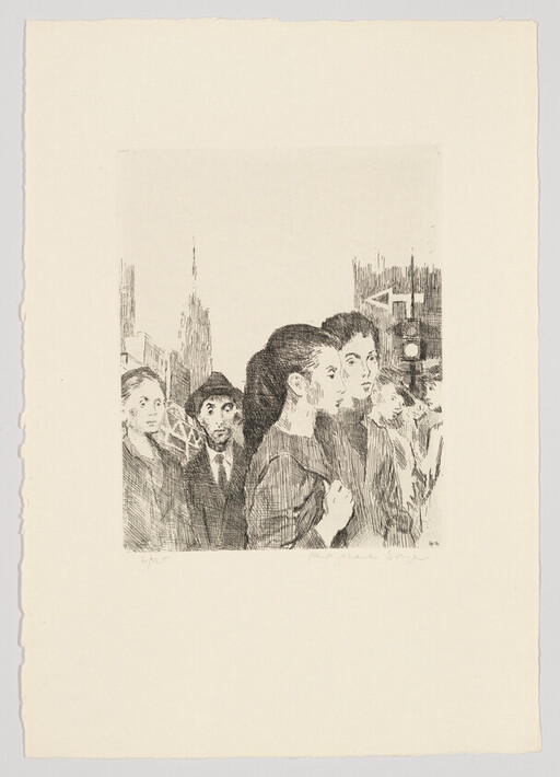 A group of people on a city street stand close together and look ahead.