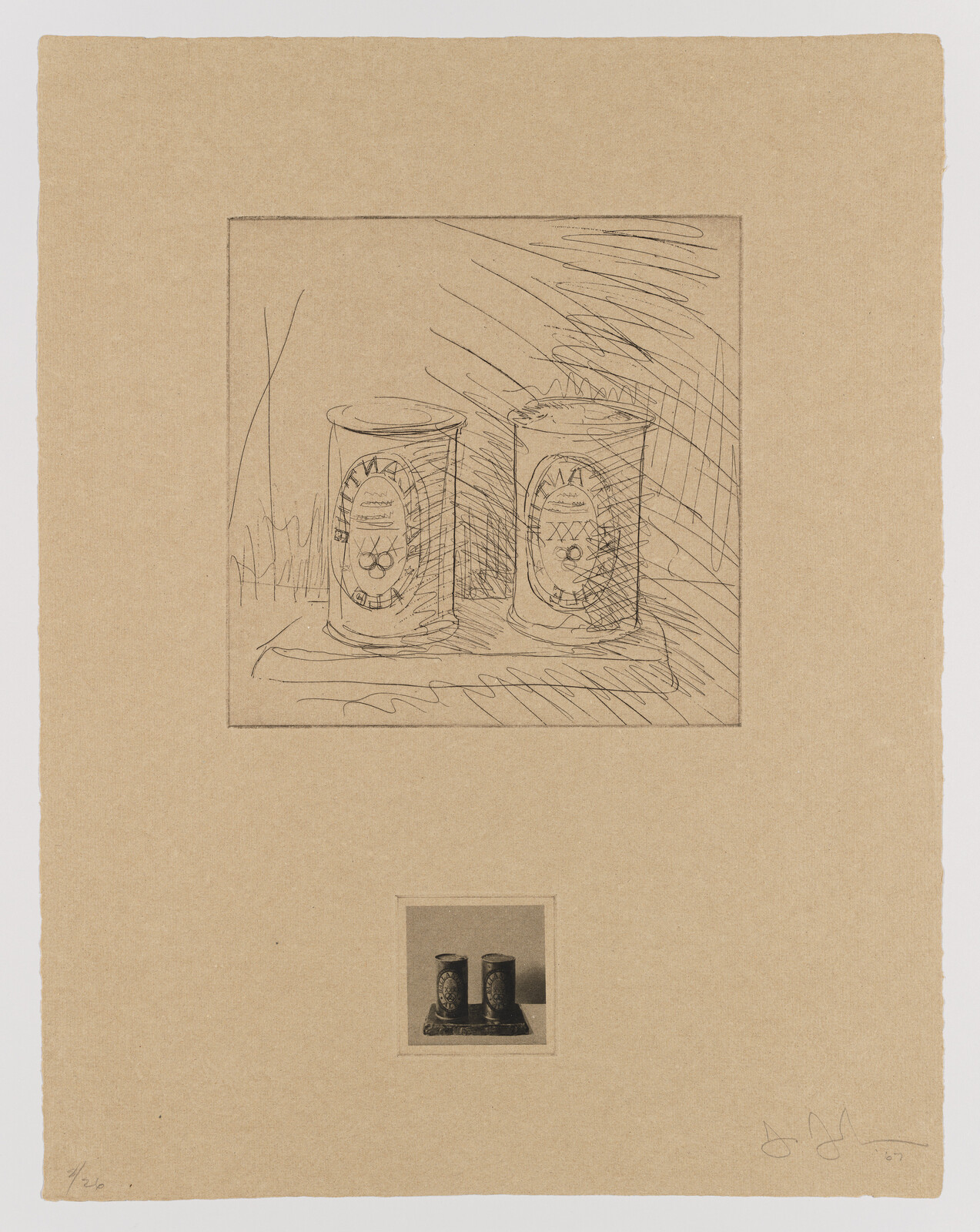 Two decorated metal cans sitting side by side on a small tray, shown in sketch and photo.