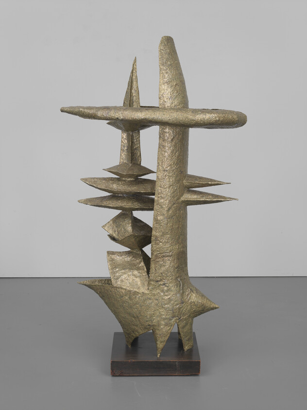 Bronze abstract sculpture with vertical pillars and stacked flat discs mounted on a square base.