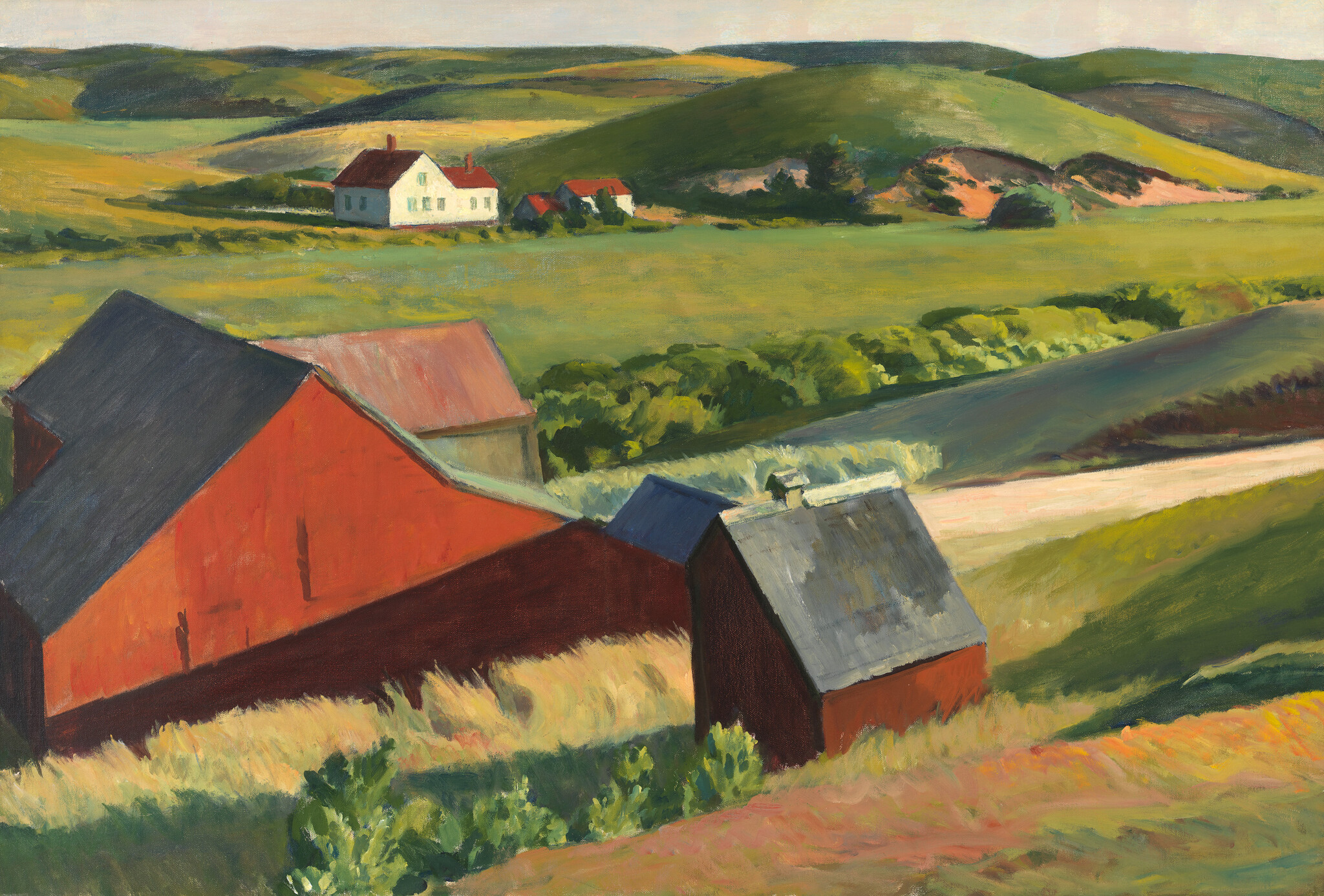 Red barns stand on a sunlit hillside with a white farmhouse in the distant green fields.