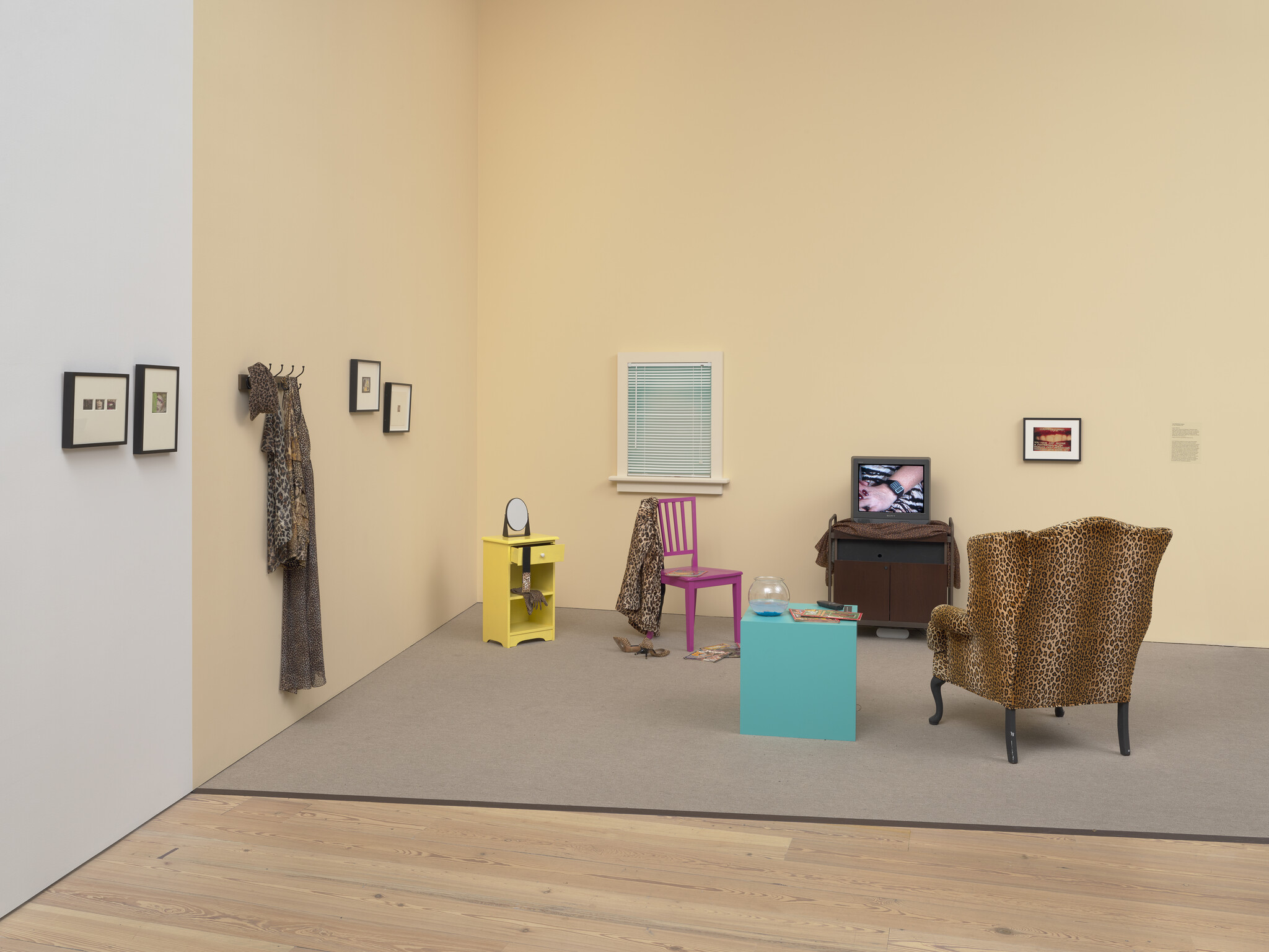 A woman’s life plays out on a TV set in the middle of her living room.