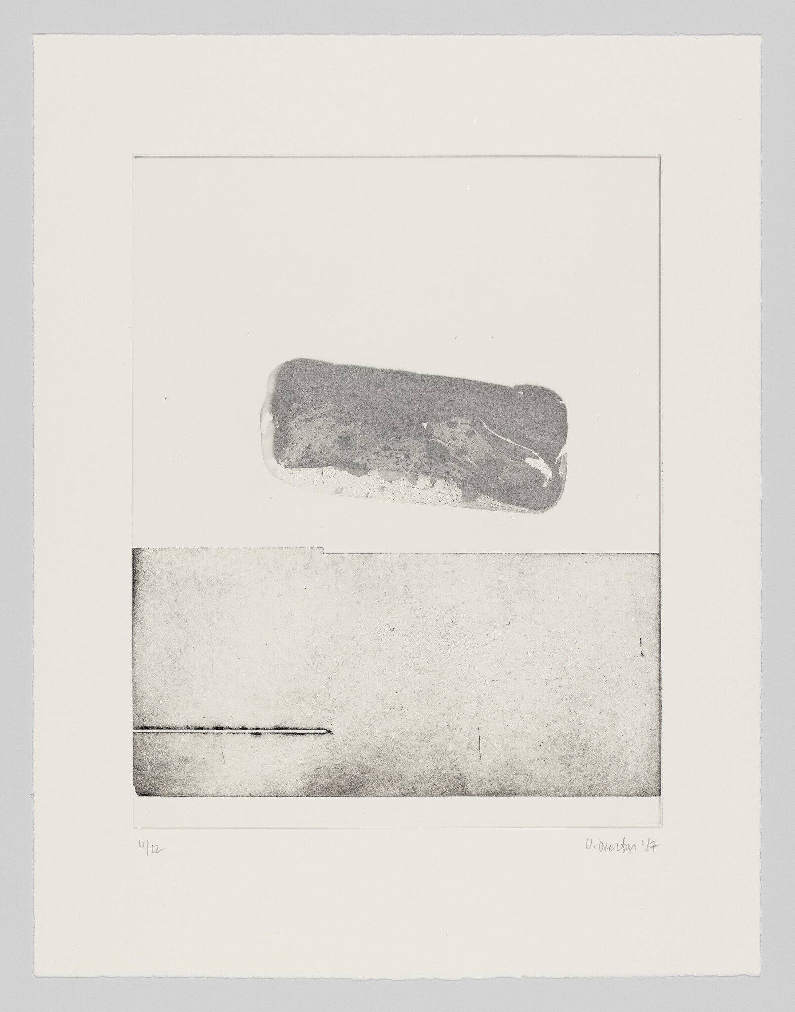 A minimal black-and-white print shows a rounded gray form above a textured rectangular panel.