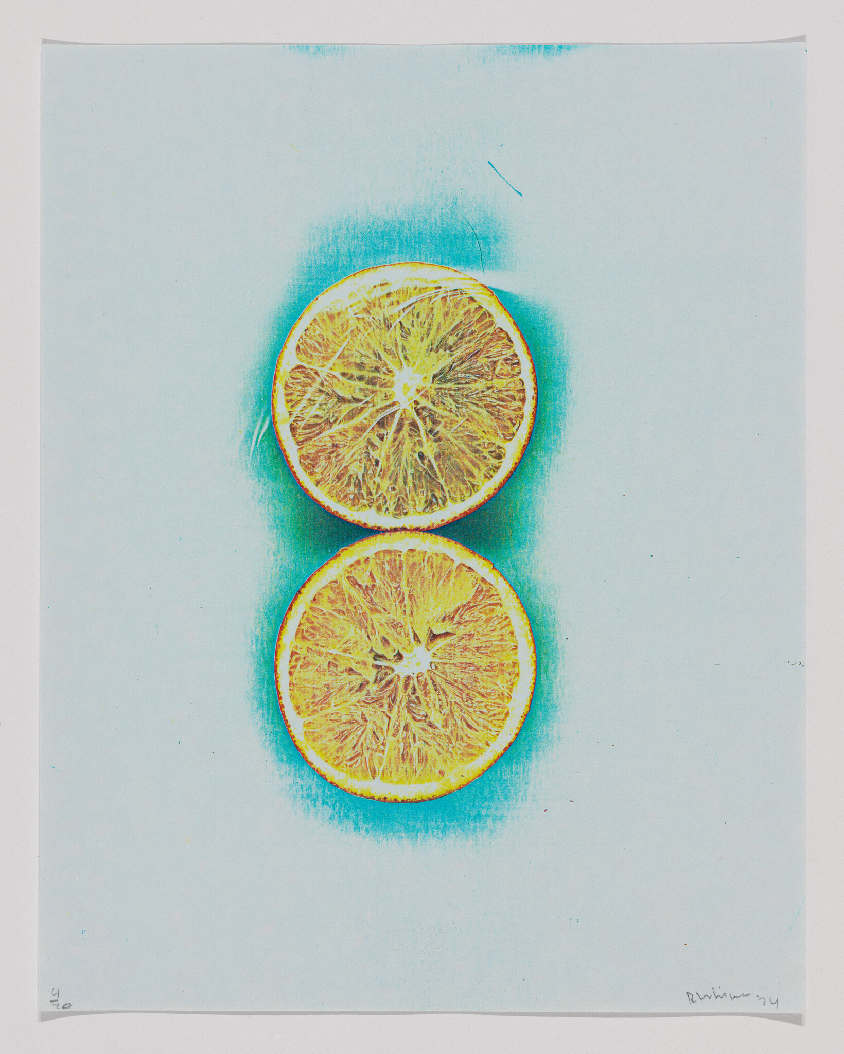 Two halved oranges are stacked vertically on a pale blue background with a cyan glow.