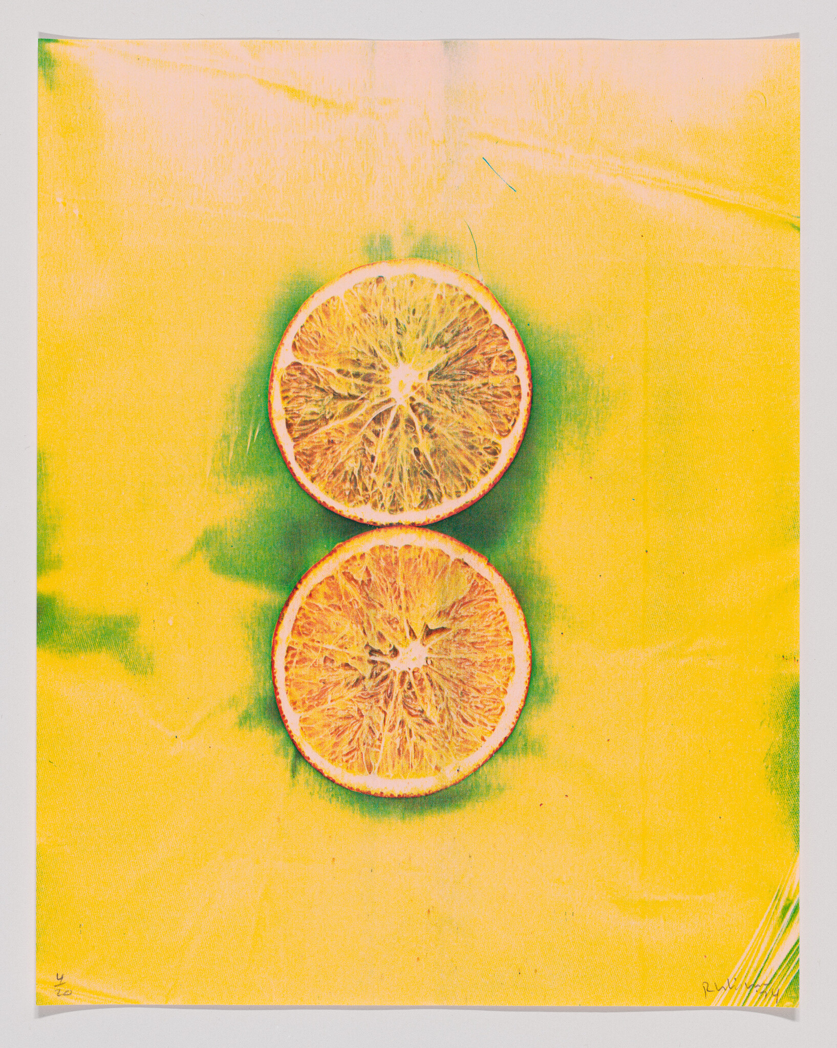 Two orange halves stacked vertically on a bright yellow background.