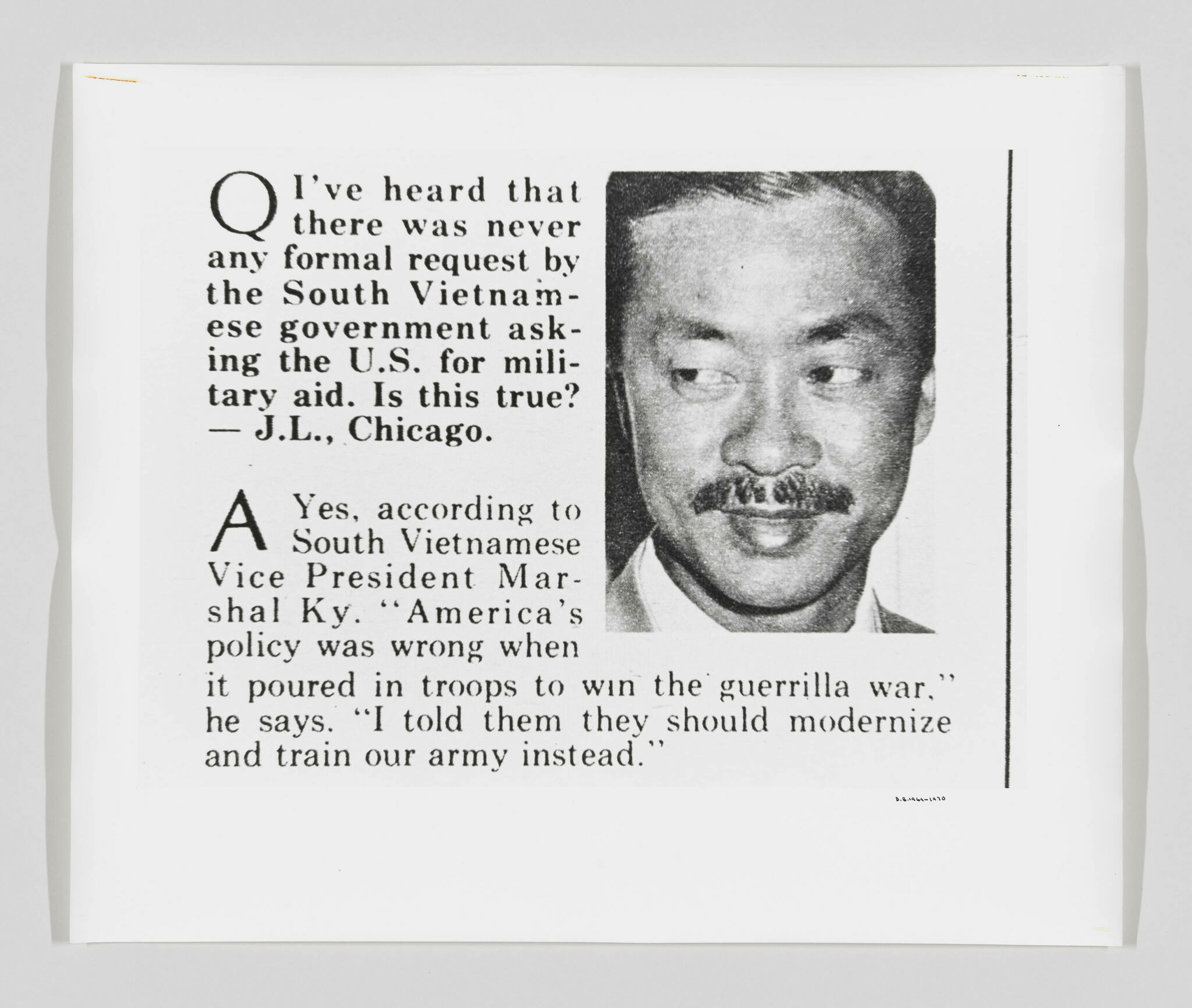 A black and white image of a newspaper clipping featuring a Q&A section with a question about the U.S. military aid to South Vietnam and an answer quoting the South Vietnamese Vice President. The clipping includes a portrait of a man with a mustache.